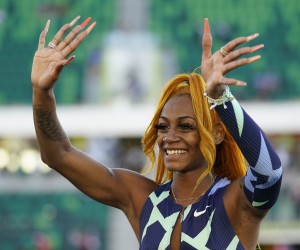 Sha'Carri Richardson waves after winning the women's 100-meter run at the U.S. Olympic Track and Field Trials Saturday, June 19, 2021, in Eugene, Ore. (AP Photo/Ashley Landis)