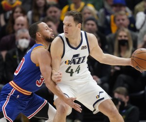 Golden State Warriors guard Stephen Curry (30) guards Utah Jazz forward Bojan Bogdanovic (44) during the first half of an NBA basketball game Wednesday, Feb. 9, 2022, in Salt Lake City. (AP Photo/Rick Bowmer)