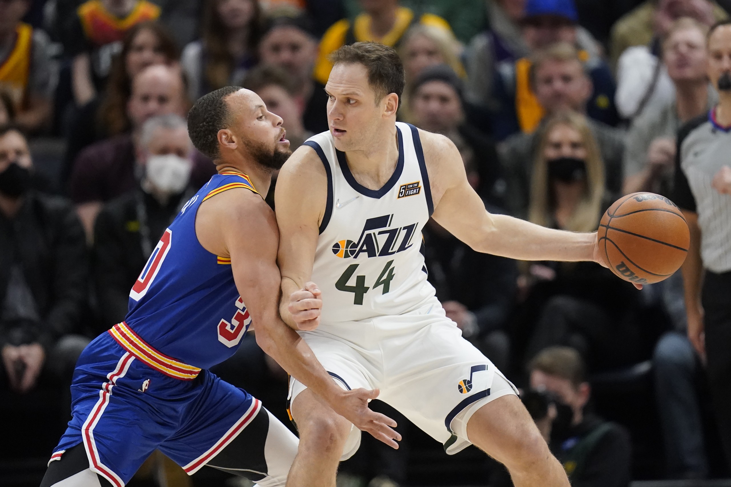 Golden State Warriors guard Stephen Curry (30) guards Utah Jazz forward Bojan Bogdanovic (44) during the first half of an NBA basketball game Wednesday, Feb. 9, 2022, in Salt Lake City. (AP Photo/Rick Bowmer)