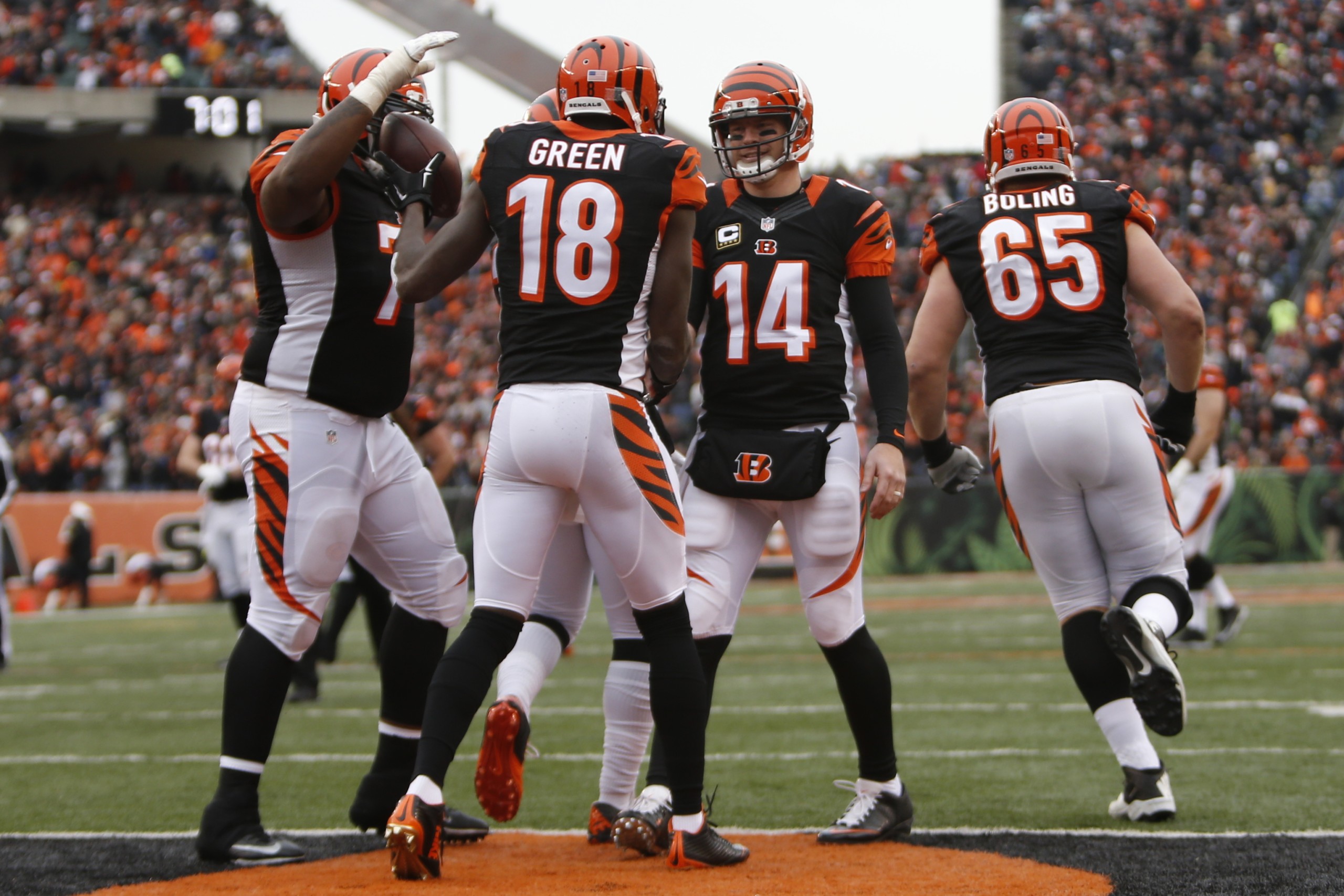 Cincinnati Bengals wide receiver A.J. Green (18) celebrates with quarterback Andy Dalton (14) after scoring a touchdown in the second half of an NFL football game against the St. Louis Rams, Sunday, Nov. 29, 2015, in Cincinnati. The Bengals won 31-7. (AP Photo/Frank Victores)