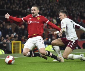 epa09677804 Manchester United's Luke Shaw (L) in action against Aston Villa's Matty Cash (R) during the English FA Cup third round soccer match between Manchester United and Aston Villa in Manchester, Britain, 10 January 2022.  EPA/Peter Powell EDITORIAL USE ONLY. No use with unauthorized audio, video, data, fixture lists, club/league logos or 'live' services. Online in-match use limited to 120 images, no video emulation. No use in betting, games or single club/league/player publications