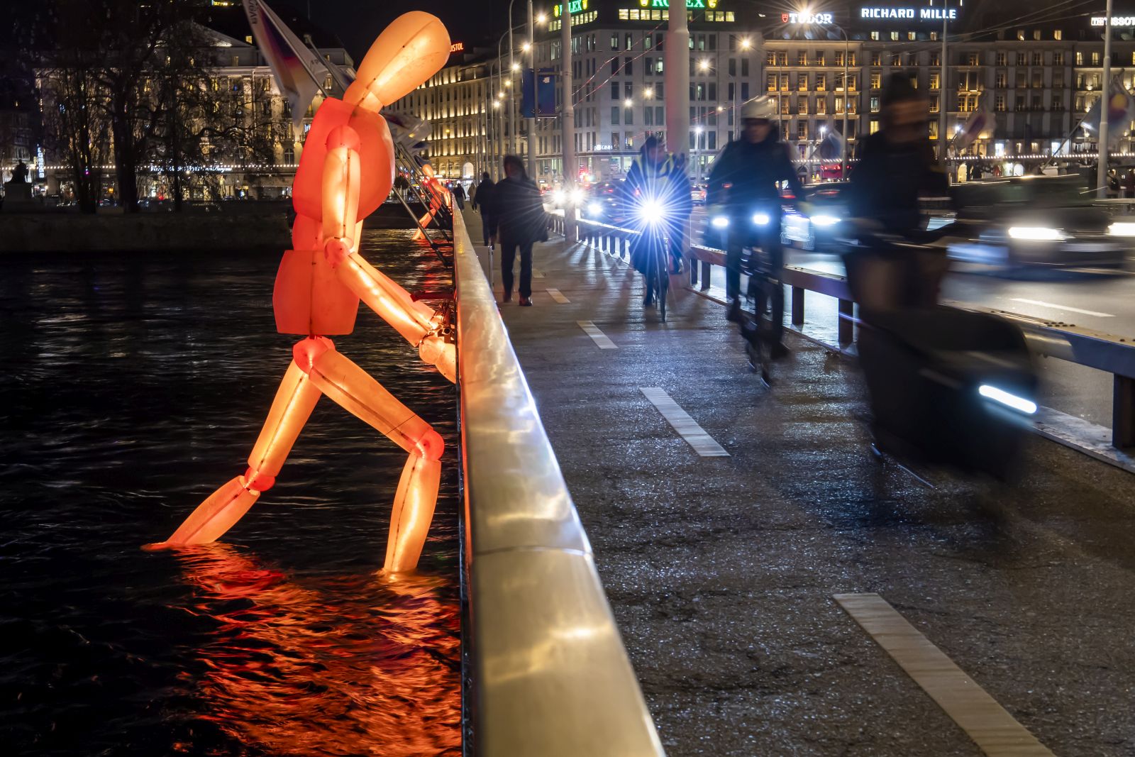 epa09695710 The new art installation 'Les Colosses' by Louxor Spectacle, is on display in Geneva, Switzerland, 19 January 2022, as one of the new light installations of the Geneva Lux Festival. In total, 23 light and decoration projects are presented around Lake Geneva and the city center. In this seventh edition of the festival, four new works complete those from last year. The arrangement of artworks by Swiss and international artists create a contemporary light show running from January 21 to February 06.  EPA/MARTIAL TREZZINI