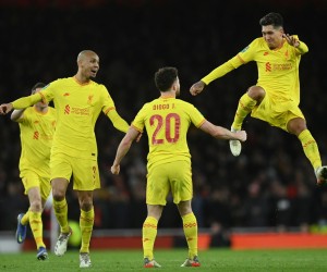 epa09698531 Liverpool's Diogo Jota (C) celebrates with teammates Fabinho (L) and Roberto Firmino (R) after scoring the 2-0 lead during the English Carabao Cup semi final, second leg soccer match between Arsenal FC and Liverpool FC in London, Britain, 20 January 2022.  EPA/Neil Hall EDITORIAL USE ONLY. No use with unauthorized audio, video, data, fixture lists, club/league logos or 'live' services. Online in-match use limited to 120 images, no video emulation. No use in betting, games or single club/league/player publications