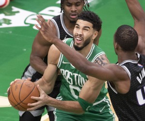 epa09709472 Boston Celtics forward Jayson Tatum (C) shoots under defending Sacramento Kings forward Harrison Barnes (R) during the first quarter at the TD Garden in Boston, Massachusetts, USA, 25 January 2022.  EPA/CJ GUNTHER  SHUTTERSTOCK OUT