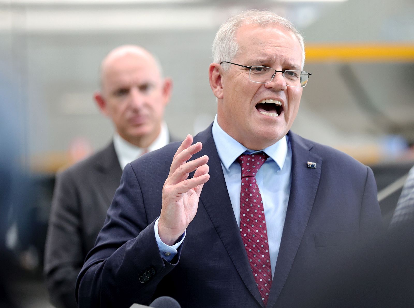 epa09726683 Australian Prime Minister Scott Morrison speaks to the media during a visit to KOR Equipment Solutions in Mulgrave, Melbourne, Australia, 04 February 2022. Morrison backed the decision of the Western Australian (WA) premier to keep the state's borders closed amid the ongoing Covid-19 pandemic.  EPA/CON CHRONIS AUSTRALIA AND NEW ZEALAND OUT