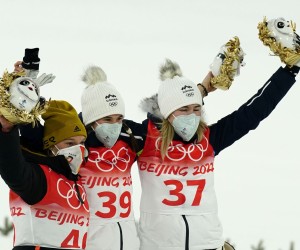epa09729883 Winner Ursa Bogataj of Slovenia (C), second placed Katharina Althaus of Germany (L) and third placed Nika Kriznar of Slovenia (R) celebrate after the Women's Ski Jumping Normal Hill final at the Zhangjiakou National Ski Jumping Centre at the Beijing 2022 Olympic Games, Zhangjiakou, China, 05 February 2022.  EPA/Kimimasa Mayama