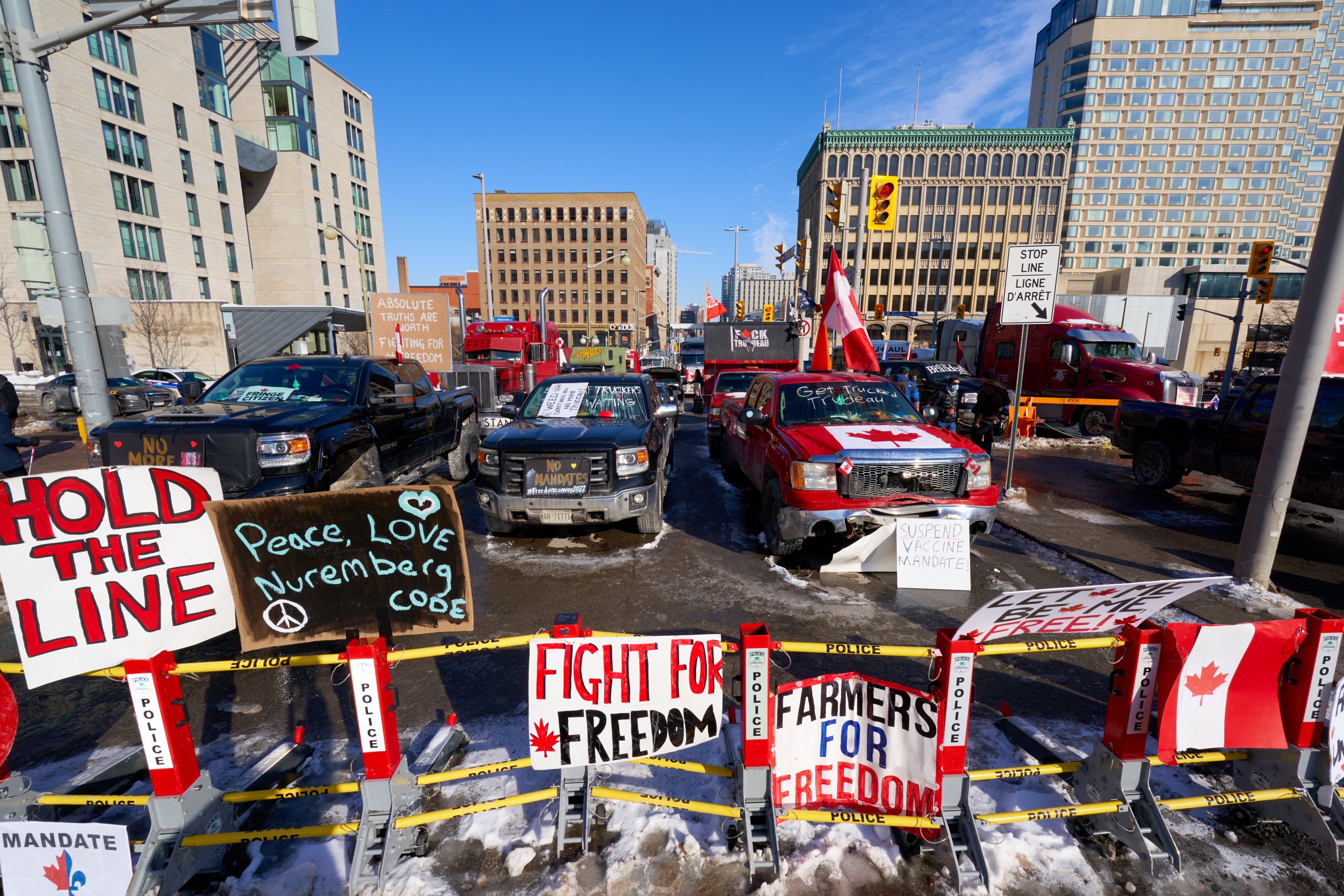 epa09736432 A view of downtown Ottawa and the Canadian parlement hill surrounded by truckers, after the mayor of Ottawa has declared a state of emergency in the Canadian capital after a 10-day-long protest by truck drivers over Covid-19 restrictions that has gridlocked its city center, in Ottawa, Canada, 07 February 2022. Truckers protested against the mandate by the Canadian government that truckers be vaccinated to return to Canada, and was joined by other opponents of the Canadian Prime Minister. Policemen from Ottawa city, Ontario, and the Federal Royal Canadian Mounted Police (RCMP) are deployed.  EPA/ANDRE PICHETTE