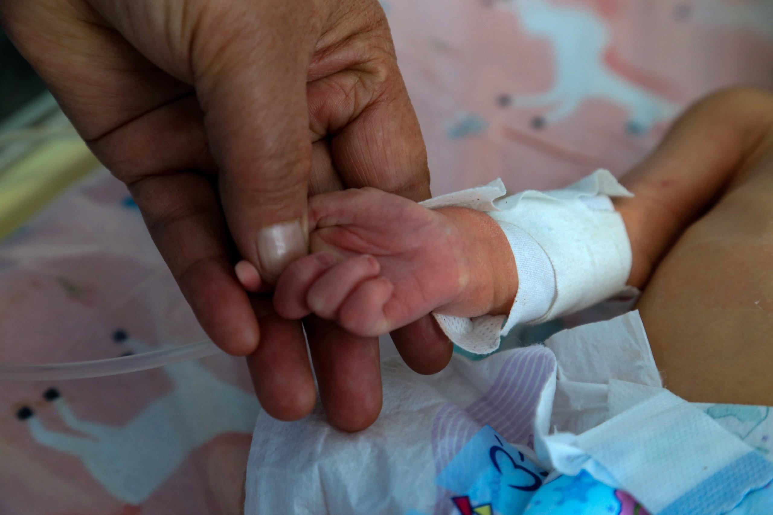 epa09742895 An Afghan nurse attends to newborn babies at Malalai National And Specialized Hospital catering to maternity needs of Afghan women, in Kabul, Afghanistan, 08 February 2022 (issued 10 February 2022). The Taliban government has appointed doctor Malalai Faizi as the director of a maternity hospital in Kabul in the first ever appointment of a woman as the head of a public institution under the Islamist administration. The appointment is an unprecedented moment in the Taliban's policies towards women since the Islamists seized power on Aug.15, as women had been excluded from public offices so far, apart from facing curbs on their freedom of movement and accessing high-school education as well as other jobs. The Unicef has warned that one million children in Afghanistan may die of acute malnutrition if urgent action wasn't taken. According to UN estimates, more than half of the population will be facing famine this winter, and 97 percent of the population could fall below the poverty line this year.  EPA/STRINGER