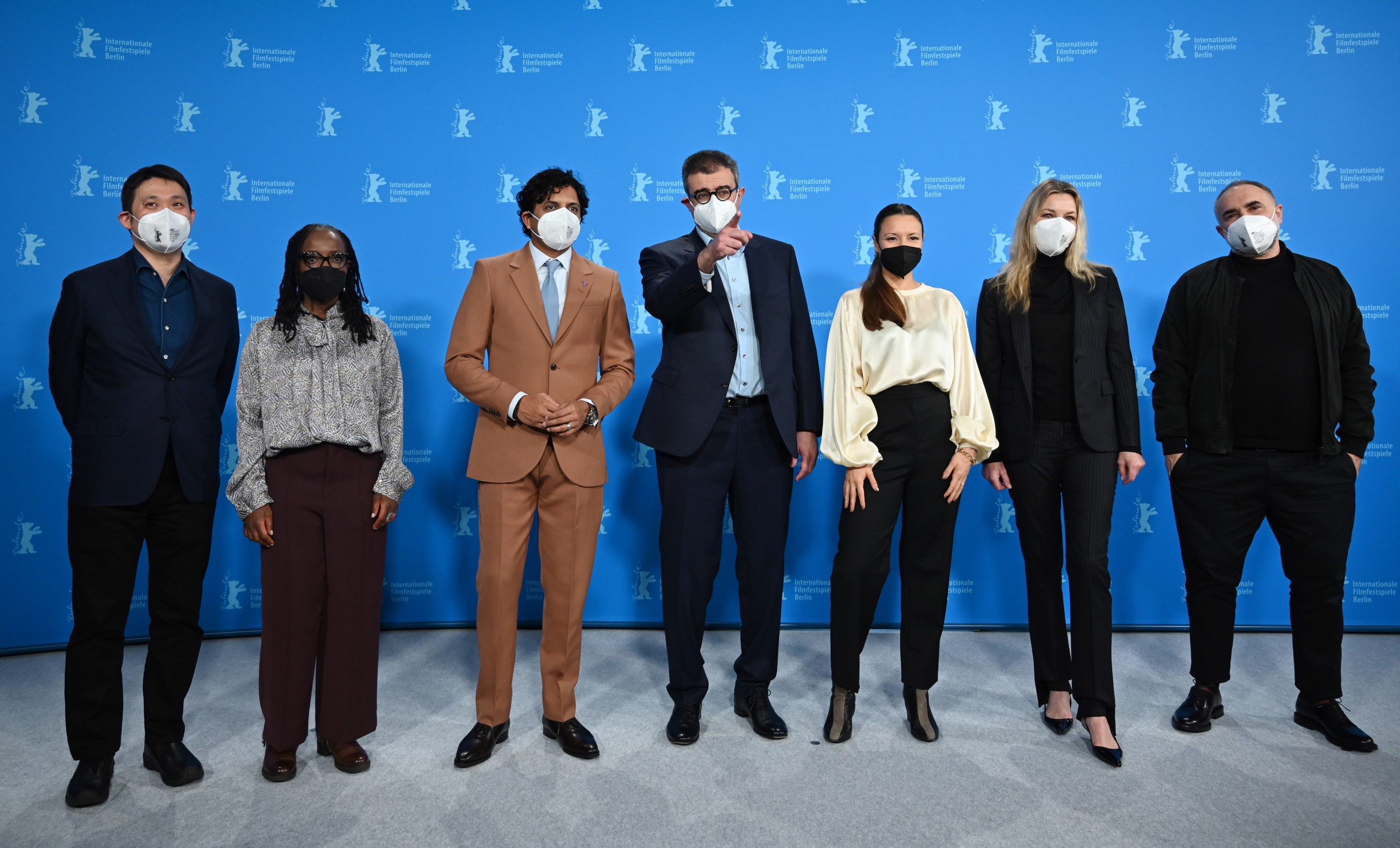 epa09743403 (L-R) Japanese screenwriter and director Ryusuke Hamaguchi, Zimbabwan filmmaker Tsitsi Dangarembga, US screenwriter, producer, director and Berlinale Jury President M. Night Shyamalan, French-Tunisian producer Said Ben Said, German screenwriter and director Anne Zohra Berrached, Danish actress and producer Connie Nielsen and Brazilian-Algerian screenwriter, director and vuisual artist Karim Ainouz pose at the photocall of the International Jury during 72nd annual Berlin International Film Festival (Berlinale) in Berlin, Germany, 10 February 2022. The film festival runs from 10 to 20 February 2022.  EPA/SASCHA STEINBACH