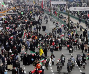 epa09746357 Iranians take part during a rally marking the 43rd anniversary of the 1979 Islamic Revolution, at the Azadi (Freedom) square in Tehran, Iran, 11 February 2022. The event marks the 43rd anniversary of the Islamic revolution, which came ten days after Ayatollah Ruhollah Khomeini returned from his exile in Paris to Iran, toppling the monarchy system and forming the Islamic Republic.  EPA/ABEDIN TAHERKENAREH