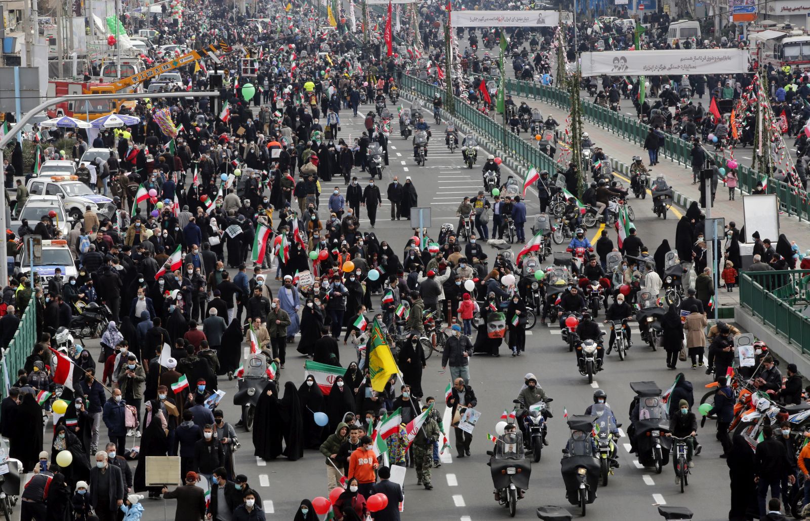 epa09746357 Iranians take part during a rally marking the 43rd anniversary of the 1979 Islamic Revolution, at the Azadi (Freedom) square in Tehran, Iran, 11 February 2022. The event marks the 43rd anniversary of the Islamic revolution, which came ten days after Ayatollah Ruhollah Khomeini returned from his exile in Paris to Iran, toppling the monarchy system and forming the Islamic Republic.  EPA/ABEDIN TAHERKENAREH