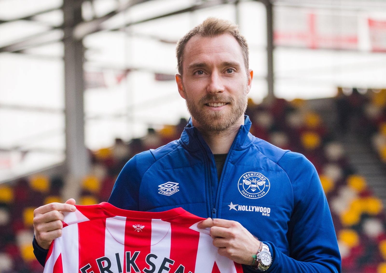 epa09747532 Danish soccer player Christian Eriksen is presented as a new player of English Premier League soccer club Brentford F.C. at Brentford Community Stadium in London, Britain, 11 February 2022. Christian Eriksen has been fitted with an implanted cardioverter-defibrillator (ICD), a type of pacemaker after collapsing while playing for Denmark at Euro 2020 and suffering cardiac arrest.  EPA/VICKIE FLORES