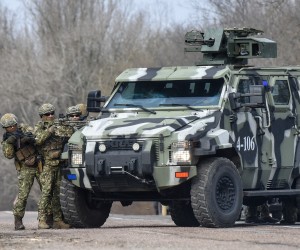 epa09750326 Ukrainian police and National Guard servicemen take part in an exercises near the Kalanchak village of Skadovsk district of Kherson area, South Ukraine, 12 February 2022. The special tactical training exercises for timely and effective response to situation with destabilizing factors were conducted in Kherson region, which are located critically close to the administrative border with Crimea peninsula annexed by Russia in 2014. More than thousand law enforcement officers (police, National Guard, State Emergency Service, Border Guard service, State migration Service and so on) special equipment, including a helicopter group were involved in the exercises.  EPA/OLEG PETRASYUK