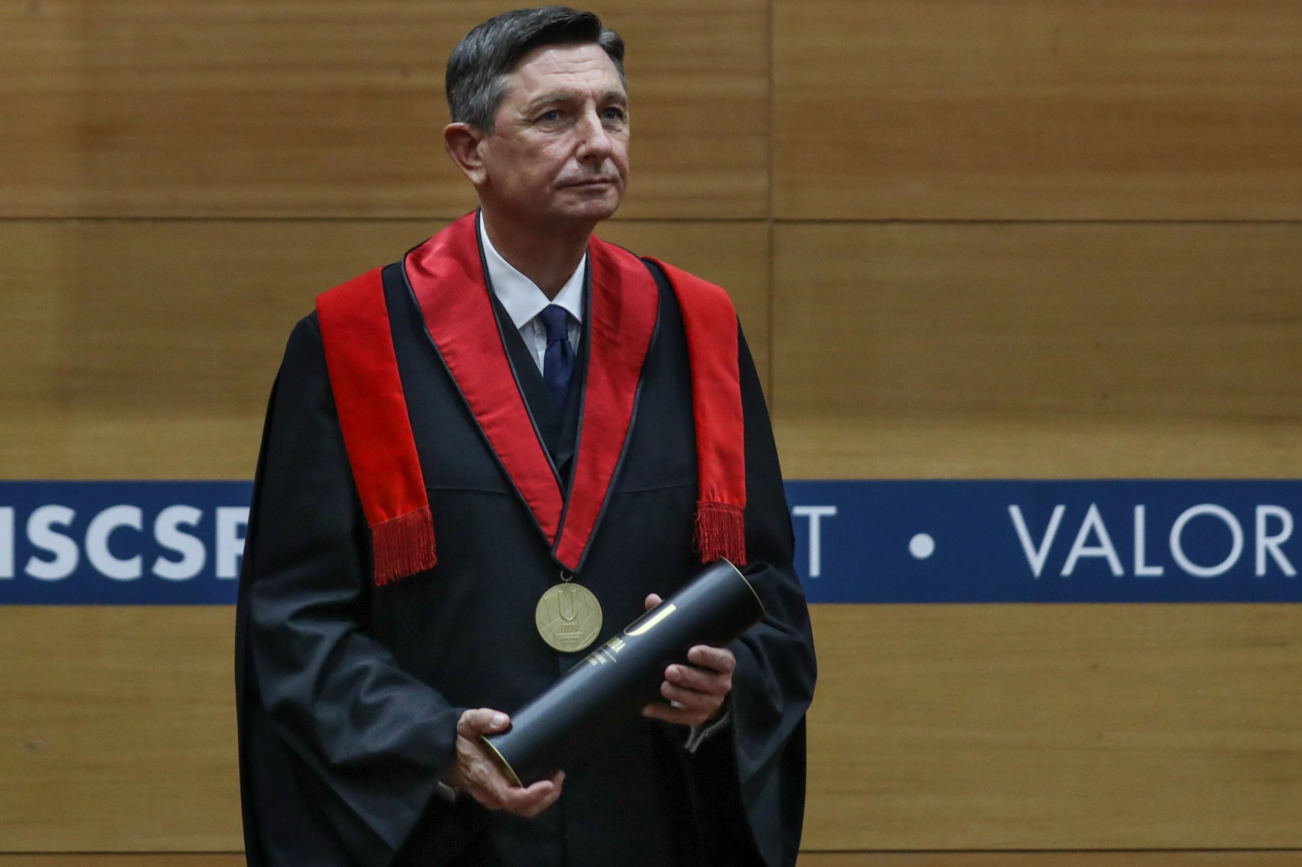 epa09758795 Slovenia's President Borut Pahor during the ceremony of awarding the Doctor Honoris Causa by the Higher Institute of Social and Political Sciences (ISCSP) of the University of Lisbon in Lisbon, Portugal, 15 February 2022. Borut Pahor is on a two-day official visit to Portugal.  EPA/ANTONIO COTRIM