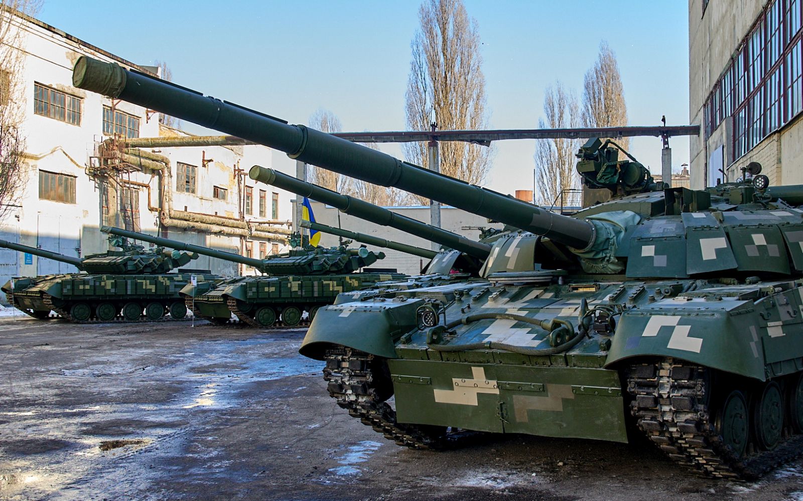 epa09759418 Repaired Ukrainian tanks are seen during a press tour on the Armored Plant in the Eastern Ukrainian city of Kharkiv, 15 February 2022 amid escalation on the Ukraine-Russian border. According to the survey conducted by the Kiev's International Institute of Sociology in February, in the case of armed intervention of Russia 57.5percent of Ukrainians are ready to resist against 50.2percent of respondents were ready for such actions in December.  EPA/SERGEY KOZLOV
