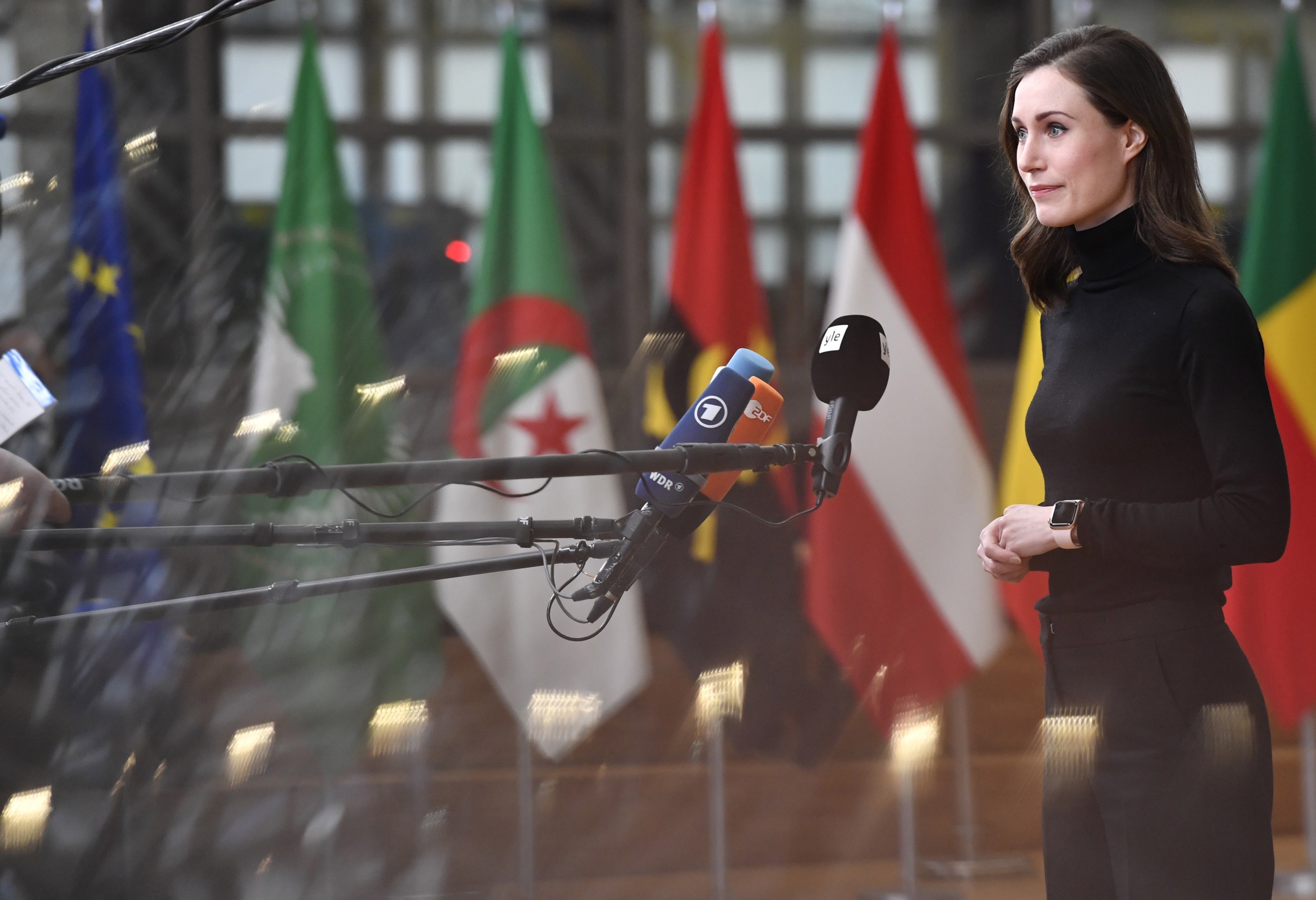 epa09768373 Finland's Prime Minister Sanna Marin speaks with the media as she arrives for an EU Africa summit in Brussels, Belgium, 18 February 2022. European Union leaders lauded the bloc's vaccine cooperation with Africa in the fight against the coronavirus, but there was no sign they would move toward a temporary lifting of intellectual property rights protection for COVID-19 shots.  EPA/GEERT VANDEN WIJNGAERT / POOL