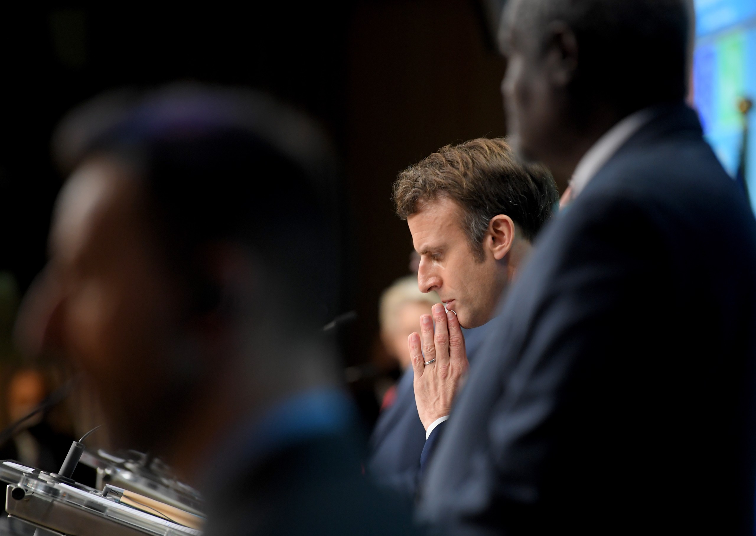epa09769560 French President Emmanuel Macron (C) gives a press conference next to Chairperson of the African Union Commission Moussa Faki Mahamat (R) on the second day of a European Union (EU) African Union (AU) summit at The European Council Building in Brussels, Belgium, 18 February 2022.  EPA/JOHN THYS / POOL