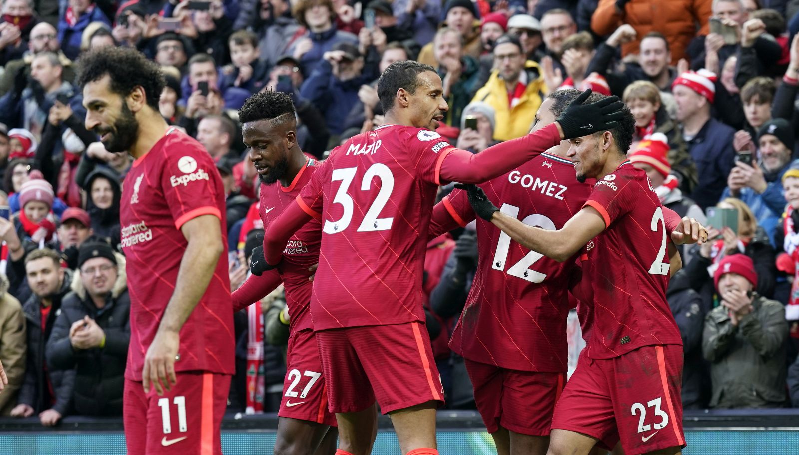 epa09772603 Liverpool's Luis Diaz (R) celebrates with teammates after scoring the 3-1 lead during the English Premier League soccer match between Liverpool FC and Norwich City in Liverpool, Britain, 19 February 2022.  EPA/TIM KEETON EDITORIAL USE ONLY. No use with unauthorized audio, video, data, fixture lists, club/league logos or 'live' services. Online in-match use limited to 120 images, no video emulation. No use in betting, games or single club/league/player publications.