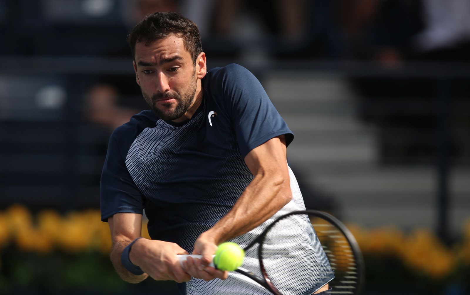 epa09775460 Marin Cilic of Croatia in action during his first round match against Jiri Vesely of the Czech Republic at the Dubai Duty Free Tennis ATP Championships 2022 in Dubai, United Arab Emirates, 21 February 2022.  EPA/ALI HAIDER