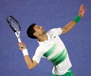 epa09776017 Novak Djokovic of Serbia serves during his first round match against Lorenzo Musetti of Italy at the Dubai Duty Free Tennis ATP Championships 2022 in Dubai, United Arab Emirates, 21 February 2022.  EPA/ALI HAIDER