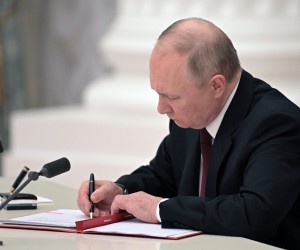 epa09776137 Russian President Vladimir Putin signs decrees on the recognition of the self-proclaimed Donetsk People's Republic (DPR) and the Luhansk People's Republic (LPR) in Moscow Kremlin in Moscow, Russia, 21 February 2022. The heads of the self-proclaimed Donetsk People's Republic (DPR) and the Luhansk People's Republic (LPR) asked the President of Russia to recognize the self-proclaimed republics. This issue was discussed at a meeting of the Security Council of the Russian Federation, Vladimir Putin appealed to the Federal Assembly of the Russian Federation to ratify the treaty of friendship and mutual assistance with the DPR-LPR. Putin  signed decrees on the recognition of the self-proclaimed Donetsk People's Republic (DPR) and the Luhansk People's Republic (LPR).  EPA/ALEKSEY NIKOLSKYI/SPUTNIK/KREMLIN POOL / POOL