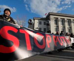 epa09777142 Ukrainians protest in front of the Russian embassy in Kiev, Ukraine, 22 February 2022 amid escalation on the Ukraine-Russian border. Russia on 21 February 2022 recognized the eastern Ukrainian self-proclaimed breakaway regions as independent states and ordered the deployment of peacekeeping troops to the Donbas, triggering an expected series of economic sanctions announcements by Western countries. The self-proclaimed Donetsk People's Republic (DNR) and Luhansk People's Republic (LNR) declared independence in 2014 amid an armed conflict in eastern Ukraine.  EPA/SERGEY DOLZHENKO