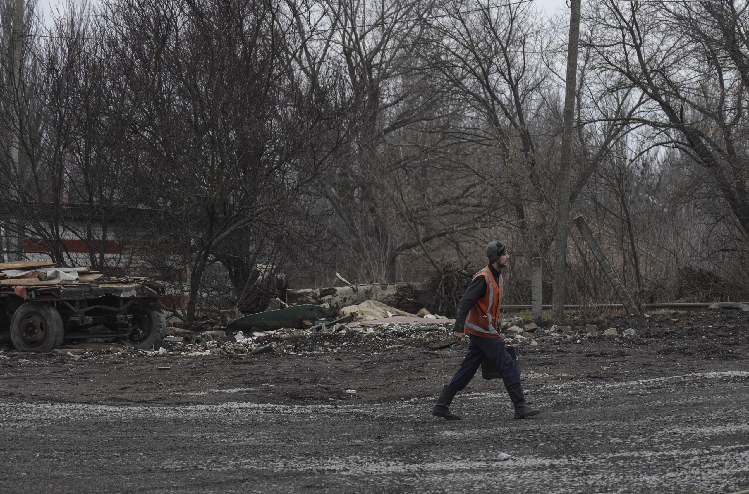 epa09781199 Ukrainian man walks on a street in Kharkiv, Ukraine, 24 February 2022.  Russian troops launched a major military operation on Ukraine on 24 February, after weeks of intense diplomacy and the imposition of Western sanctions on Russia aimed at preventing an armed conflict in Ukraine. Martial law has been introduced in Ukraine, explosions are heard in many cities, including Kiev.  EPA/STANISLAV KOZLIUK