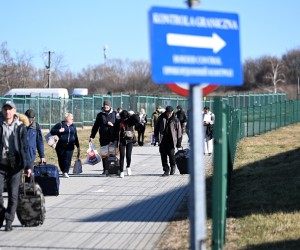epa09781466 People walk near the Polish-Ukrainian border crossing in Medyka, Poland 24 February 2022. The Polish Ministry of Interior and Administration informed they have reception points for refugees from Ukraine, eight such points will be created in the first stage. They will provide food, medical assistance and information for refugees. Russian troops entered Ukraine on 24 February prompting the country's president to declare martial law.  EPA/WOJTEK JARGILO POLAND OUT