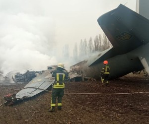 epa09781411 A handout photo released by the press service of the State Emergency Service of Ukraine on 24 February 2022 shows emergency services working at the crash site of a military plane of the Armed Forces of Ukraine, in the Obukhiv district, near Kiev, Ukraine (issued 24 February 2022). According to Ukraine's State Emergency Service the aircraft, with 14 people on board, crashed, with a subsequent fire, in the Kyiv region. Five people died in the incident, the Ministry of Internal Affairs of Ukraine said in a statement.  EPA/STATE EMERGENCY SERVICE OF UKRAINE HANDOUT -- BEST QUALITY AVAILABLE -- MANDATORY CREDIT: STATE EMERGENCY SERVICE OF UKRAINE -- HANDOUT EDITORIAL USE ONLY/NO SALES