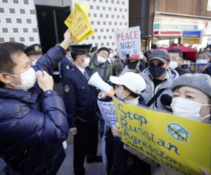 epa09783460 People shout slogans as they protest against Russia's invasion of Ukraine, outside the Russian Embassy in Tokyo, Japan, 25 February 2022. Japan's Prime Minister Fumio Kishida said he will impose sanctions against Russia following its invasion of Ukraine. Russian troops entered Ukraine on 24 February.  EPA/FRANCK ROBICHON