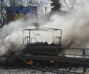 epaselect epa09786502 Smoke rises from a burning vehicle after night fighting in Kiev, Ukraine, 26 February 2022. Russian troops entered Ukraine on 24 February prompting the country's president to declare martial law and triggering a series of announcements by Western countries to impose severe economic sanctions on Russia.  EPA/ANDRII NESTERENKO
