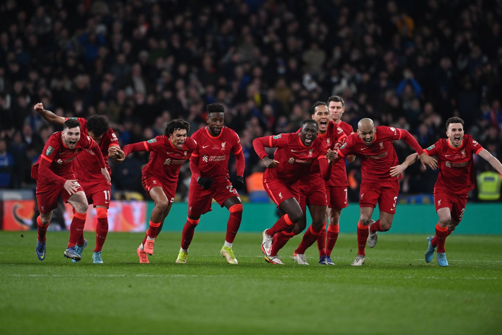 epa09789939 Players of Liverpool celebrate their victory after the penalty shoot out of the English Carabao Cup final match between Chelsea FC and Liverpool FC at the Wembley stadium in London, Britain, 27 February 2022.  EPA/ANDY RAIN EDITORIAL USE ONLY. No use with unauthorized audio, video, data, fixture lists, club/league logos or 'live' services. Online in-match use limited to 120 images, no video emulation. No use in betting, games or single club/league/player publications