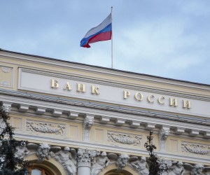 epa09791192 The Russian National flag waves atop the Bank of Russia headquarters in Moscow, Russia, 28 February 2022. The Bank of Russia decided to raise the key rate from 9.5 percent to 20 percent per annum starting 28 February. The Central Bank attributed this to a radical change in external conditions. The measure was taken in light of harsh sanctions imposed by the international community on Russia following its troops entering Ukraine on 24 February, and the subsequent collapse of the ruble.  EPA/SERGEI ILNITSKY
