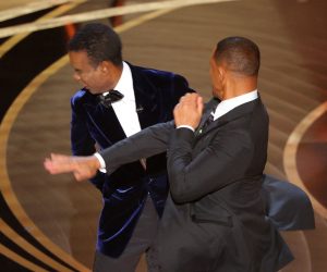 Will Smith hits at Chris Rock as Rock spoke on stage during the 94th Academy Awards in Hollywood, Los Angeles, California, U.S., March 27, 2022. REUTERS/Brian Snyder
