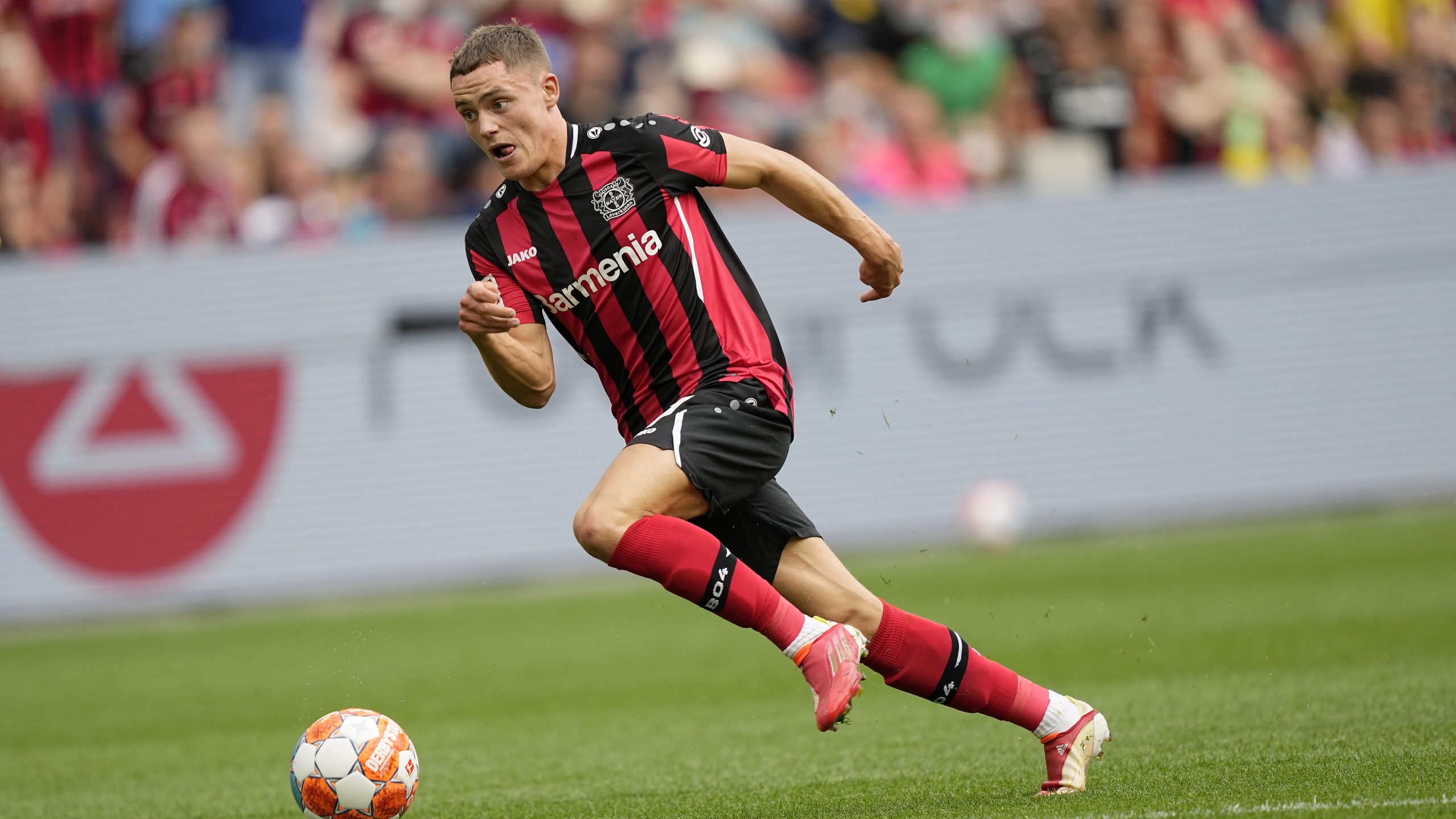 Leverkusen's Florian Wirtz plays the ball during the German Bundesliga soccer match between Bayer Leverkusen and Borussia Dortmund in Leverkusen, Germany, Saturday, Sept. 11, 2021. (AP Photo/Martin Meissner)