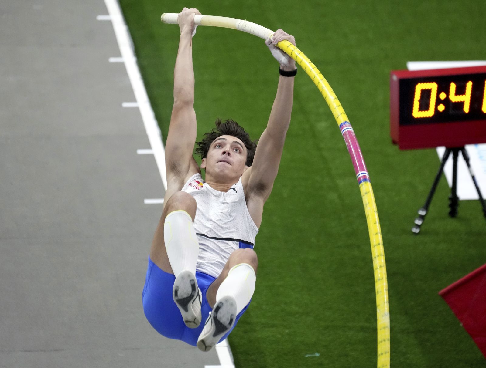 Sweden's Armand Duplantis competes during the men's pole vault competition as part of the 2022 Indor ISTAF track and field meeting in Berlin, Germany, Friday, Feb. 4, 2022. (AP Photo/Michael Sohn)