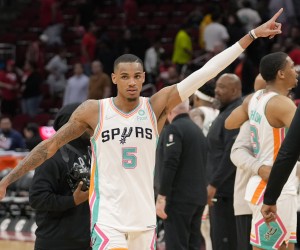 San Antonio Spurs guard Dejounte Murray (5) walks off the court after his team's win over the Houston Rockets in an NBA basketball game, Monday, March 28, 2022, in Houston. (AP Photo/Eric Christian Smith)