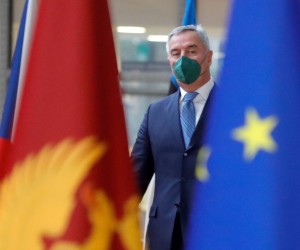 epa09775402 President of Montenegro Milo Dukanovic (L) is welcomed by European Council President Charles Michel (R) ahead of their meeting at the European Council in Brussels, Belgium, 21 February 2022.  EPA/STEPHANIE LECOCQ