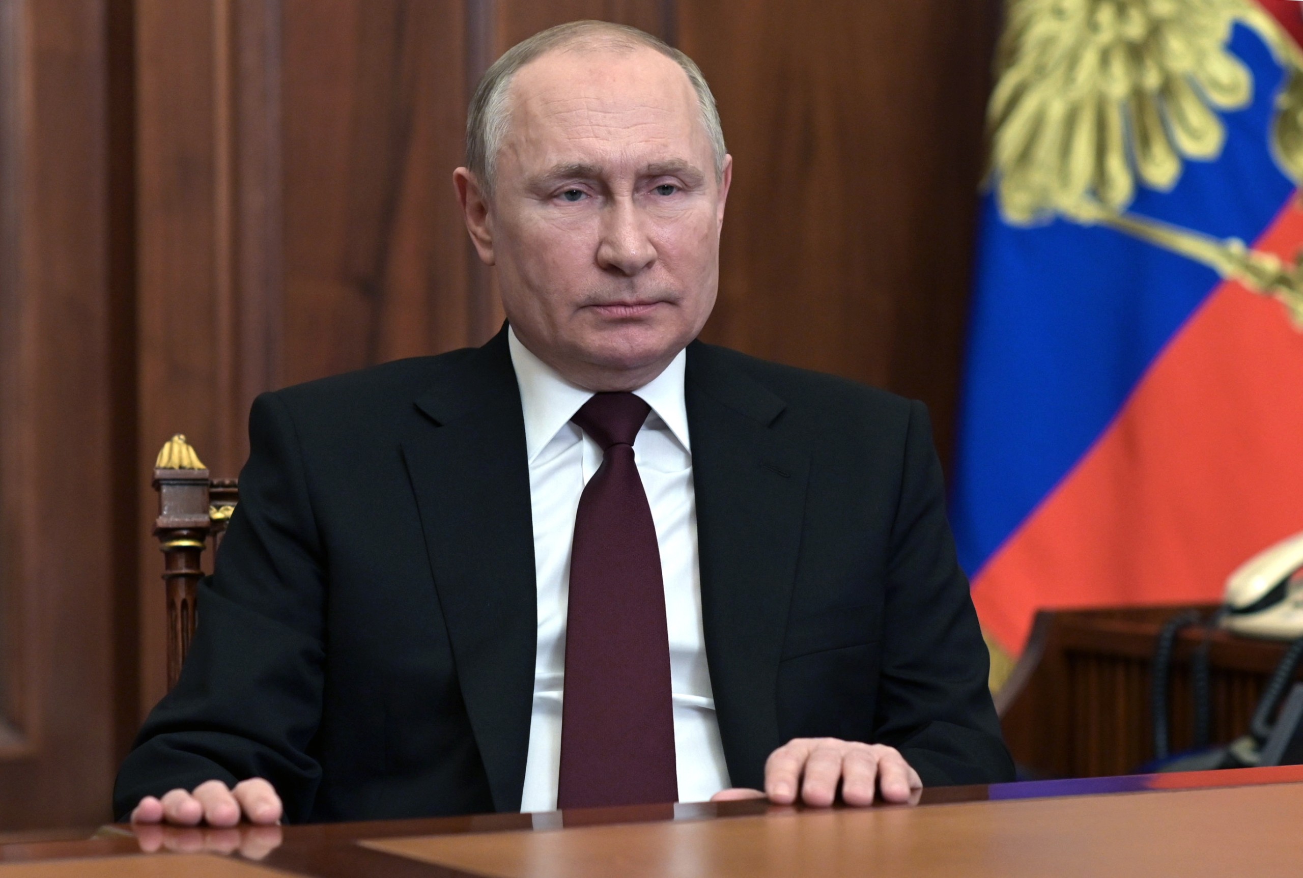 epa09776106 Russian President Vladimir Putin addresses the Russian Nation on what is happening in the Donbass and on the border with Ukraine in Moscow, Russia, 21 February 2022. The heads of the self-proclaimed Donetsk People's Republic (DPR) and the Luhansk People's Republic (LPR) asked the President of Russia to recognize the self-proclaimed republics. This issue was discussed at a meeting of the Security Council of the Russian Federation, Vladimir Putin appealed to the Federal Assembly of the Russian Federation to ratify the treaty of friendship and mutual assistance with the DPR-LPR. Putin  signed decrees on the recognition of the self-proclaimed Donetsk People's Republic (DPR) and the Luhansk People's Republic (LPR).  EPA/ALEKSEY NIKOLSKYI/SPUTNIK/KREMLIN POOL / POOL