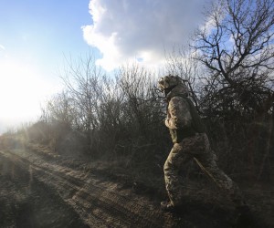 epa09777436 An Ukranian serviceman checks situation on the position near the Zaytseve village not far from pro-Russian militants controlled city of Gorlivka Donetsk area, Ukraine, 21 February 2022 (made available 22 February). Russia on 21 February 2022 recognized the eastern Ukrainian self-proclaimed breakaway regions as independent states and ordered the deployment of peacekeeping troops to the Donbas, triggering an expected series of economic sanctions announcements by Western countries. The self-proclaimed Donetsk People's Republic (DNR) and Luhansk People's Republic (LNR) declared independence in 2014 amid an armed conflict in eastern Ukraine.  EPA/ALISA YAKUBOVYCH