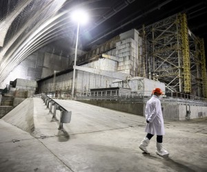 epa09781712 (FILE) - Chernobyl nuclear power plant worker  walks inside the new Safe Confinement covering the 4th block of Chernobyl Nuclear power plant in Chernobyl, Ukraine, 15 April 2021 (Reissued 24 February 2022). Ukrainian President Volodymyr Zelenskyy tweeted on 24 February that Russian forces are attempting to seize control of the Chernobyl nuclear power plant.  EPA/OLEG PETRASYUK *** Local Caption *** 56828889
