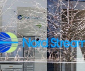epa09793328 A Nord Stream 2 logo is seen on a reflected glass front of the company's Switzerland headquarters in Zug, Switzerland, 01 March 2022. Zug-based Nord Stream 2, which is implementing the gas pipeline between Russia and Germany, has carried out a mass layoff because of the sanctions taken against Russia. 140 people have lost their jobs, said Swiss Federal Councillor Guy Parmelin.  EPA/PHILIPP SCHMIDLI