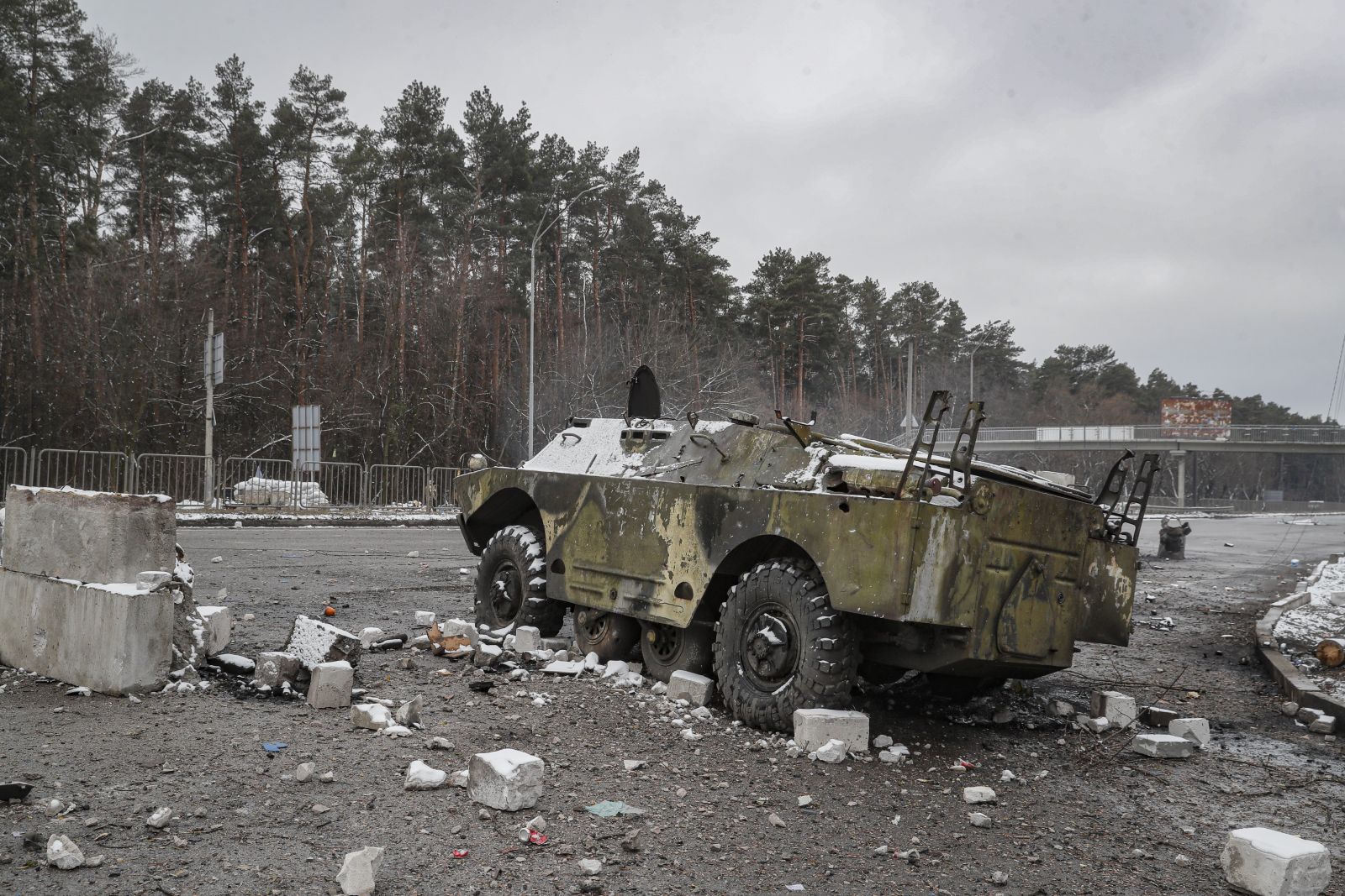 epa09793435 A damaged Ukrainian armored vehicle in the aftermath of an overnight shelling at the Ukrainian checkpoint in Brovary near Kiev (Kyiv), Ukraine, 01 March 2022. Russian troops entered Ukraine on 24 February prompting the country's president to declare martial law and triggering a series of announcements by Western countries to impose severe economic sanctions on Russia.  EPA/SERGEY DOLZHENKO