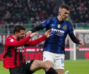 epa09794734 FC Inter's forward Edin Dzeko in action against AC Milan's defender Alessandro Florenzi (L) during the Italian Cup semi final soccer match between AC Milan and FC Inter at Giuseppe Meazza Stadium in Milan, Italy, 01 March 2022.  EPA/ROBERTO BREGANI