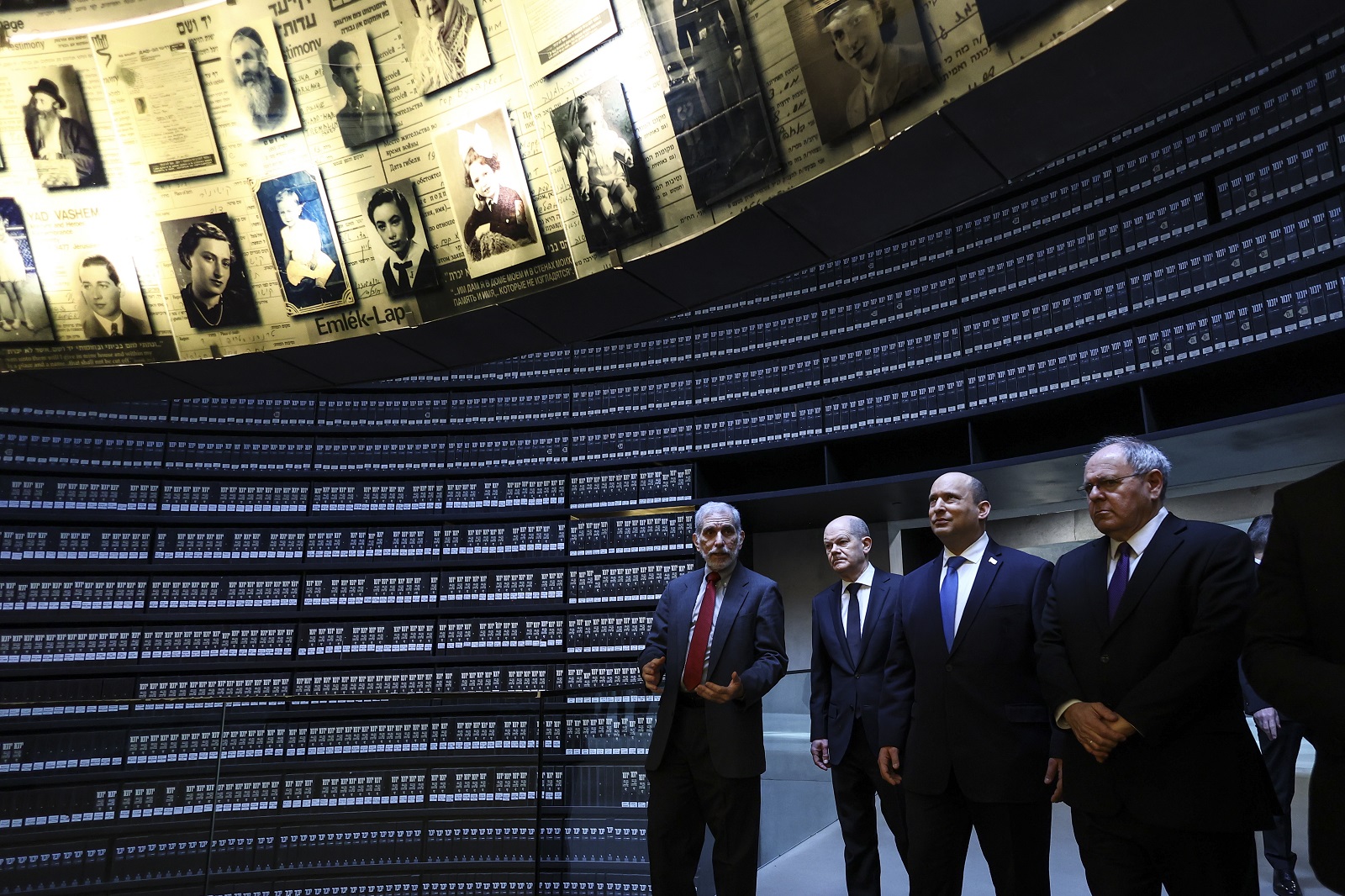 epa09796262 German Chancellor Olaf Scholz (2-L) and Israeli Prime Minister Naftali Bennett (2-R) visit the Hall of Names at Yad Vashem World Holocaust Remembrance Center during a state visit in Jerusalem, 02 March 2022.  EPA/RONEN ZVULUN / POOL