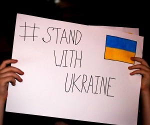 epa09797936 People show their support for Ukraine during a protest, in Montevideo, Uruguay, 02 March 2022. The group approached the door of the Russian embassy to show their support for Ukraine and to request the departure of the Russian army from Ukraine.  EPA/Raul Martinez