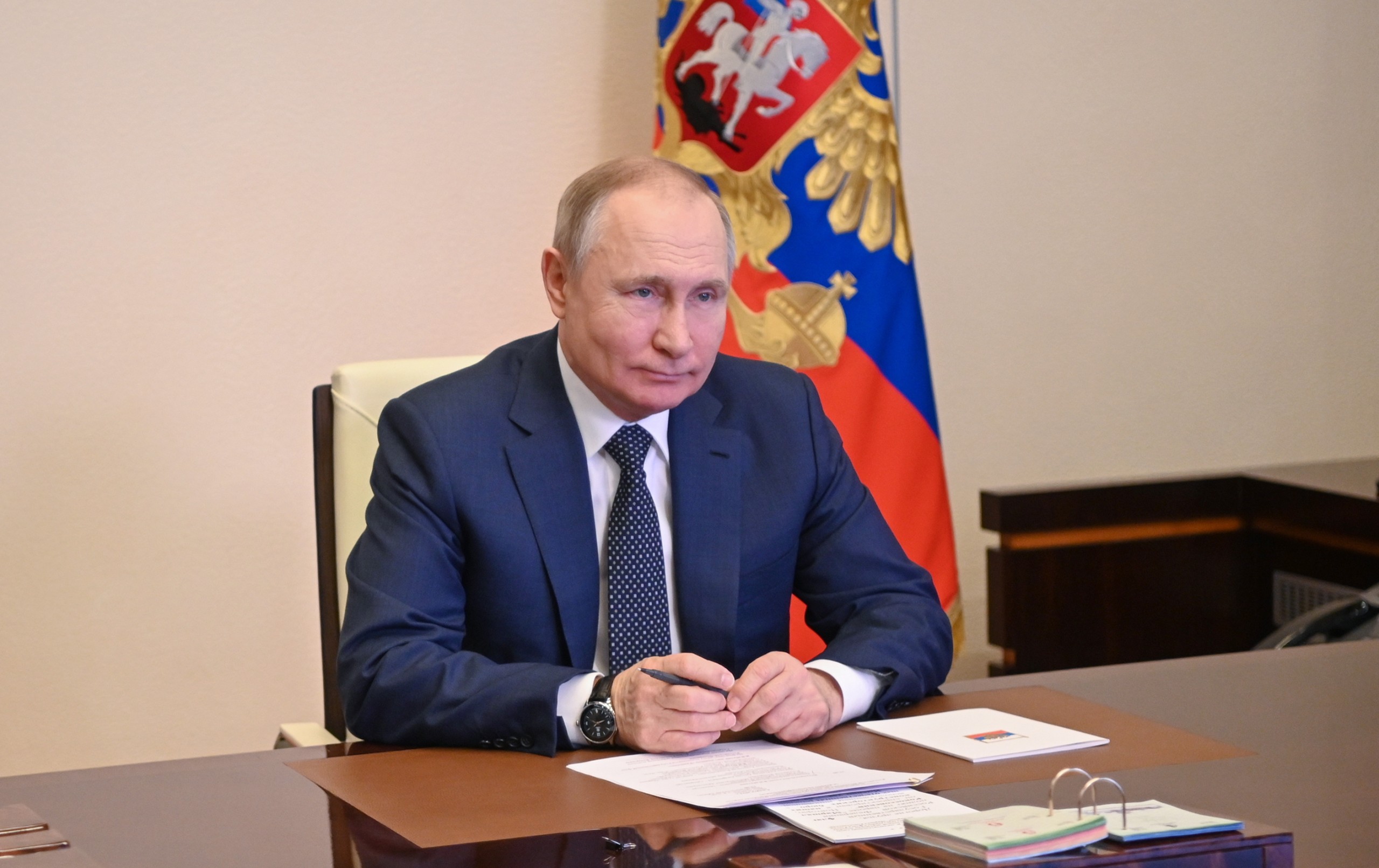 epa09800908 Russian President Vladimir Putin attends a ceremony of raising the national flag on the 'Marshal Rokossovsky' ferry in northern Russia, via a video conference at the Novo-Ogaryovo state residence outside Moscow, Russia, 04 March 2022. The new cargo ferry 'Marshal Rokossovsky', which will serve the crossing between Baltiysk in the Kaliningrad region and Ust-Luga. According to expert estimates, the annual cargo turnover of the new ferry will be approximately 0.7 - 1 million tons. The cargo turnover of the railway ferry complex in Baltiysk in 2021 increased by 9.1 per cent compared to 2020.  EPA/ANDREY GORSHKOV / SPUTNIK / KREMLIN POOL