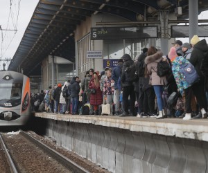 epa09803528 People wait for the arrival of an evacuation train at a railway station in Kyiv (Kiev), Ukraine, 05 March 2022. According to the United Nations (UN), at least one million people have fled Ukraine to neighboring countries since the beginning of Russia's military aggression on 24 February 2022. The UN estimates that around 160,000 Ukrainians are currently internally displaced.  EPA/SERGEY DOLZHENKO