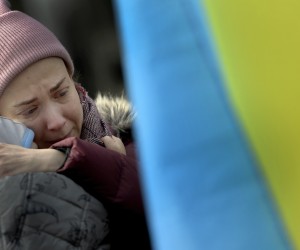 epa09804283 An Ukrainian mother cries during a rally called by the 'Association of Ukraininan people in the Spanish region of Asturias' in Oviedo, Asturias, northern Spain, against the war in Ukraine, 05 March 2022. Russia wich began on 24 February a large military invasion of Ukraine, declared on 05 March a partial ceasefire to open to open humanitarian corridors for evacuating civilians, which began from 06:00 GMT.  EPA/ELOY ALONSO