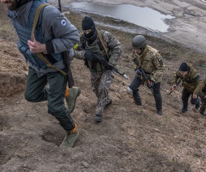 epa09806313 Members of the Territorial Defense Forces, go to a checkpoint for patrolling, in the eastern part of Kyiv (Kiev) region, Ukraine, 06 March 2022. According to the National Guard of Ukraine statistics, 100,000 Ukrainians have joined the Territorial Defense Force since the beginning of the Russian invasion of Ukraine.  EPA/ROMAN PILIPEY  ATTENTION: This Image is part of a PHOTO SET
